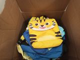 a cardboard box full of clothes with a tiger face on it
