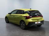 the rear of a yellow car parked in a room