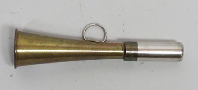 a brass bell with a ring on top of it