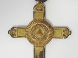 an image of a gold cross with an all seeing eye on it