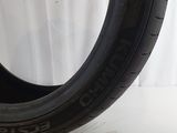 a close up of a tire on a white surface with a white background