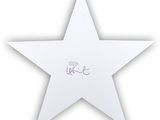 white paper star with the word love written on it
