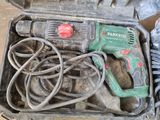 a tool in a case that is sitting on the ground