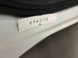 the back end of a white car with a sticker that says vauto