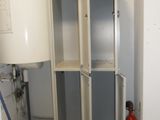 two lockers in a room with a fire extinguisor
