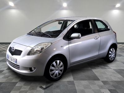 a picture of a silver toyota yaris parked in a garage