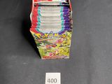 a close up of a stack of cards on a table next to a ruler