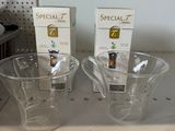 two cups that are sitting on a counter