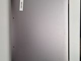 a silver laptop with a sticker on the back of it