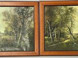 two paintings of trees and a river are hanging on a wall