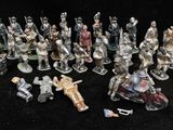 many figurines of different types and sizes on the table