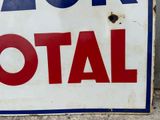 a sign that says ask total on the side of a building