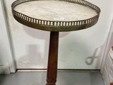 a small table that has a marble top on it