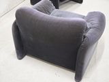 a couch and a chair that are in a room