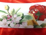 a white plate with a red rose and white flowers on it