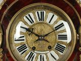 a clock that has roman numerals on the face of it