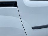 a white van parked on the side of the road