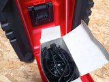 a red and black box with a black cord in it