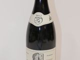 a bottle of wine that is sitting on a table