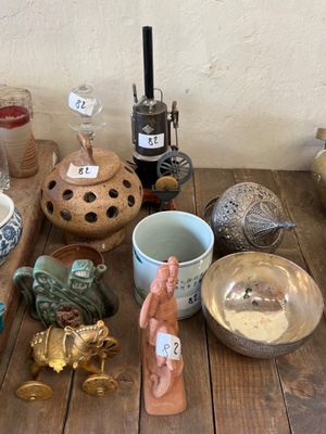 a wooden table with a lot of different items on it
