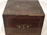 an old wooden box with a decorative design on the lid