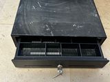 a black table with a drawer that has a key in it
