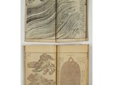 a set of four old books with drawings on them