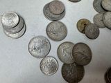 a lot of coins that are on the table