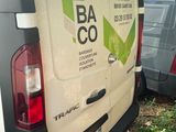 a white van that is parked in the grass