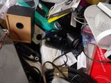 a pile of assorted electronics and electronics on the floor