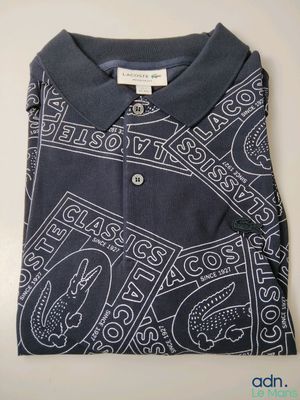 a close up of a polo shirt with a design on it
