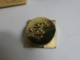 a gold plate with a number on it sitting on a table