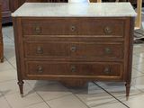 a marble top chest of drawers on display in a store