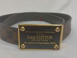 a close up of a belt with a plaque on it