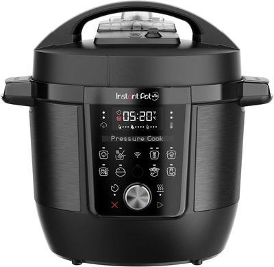 a close up of an electric pressure cooker on a white background
