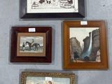 four framed pictures hanging on the wall of a room