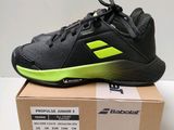 a box of tennis shoes on top of a cardboard box