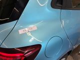 a blue car with a sticker on the back of it