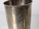 a silver cup that is sitting on a table