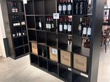 many bottles of wine on the shelves in the room