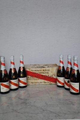 six bottles of beer are lined up in a row on a table