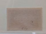 three stamps in a clear plastic case with a white background