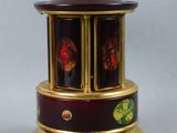 a small clock that is on top of a table
