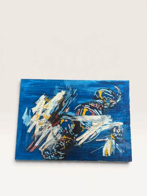 a painting of a man riding a motorcycle on top of a blue surface