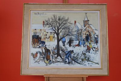 la photo d'un tableau accroché à un mur rouge