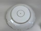a white plate with a black and white design on it