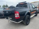 a picture of a black pick up truck parked in a parking lot