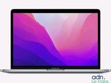 an apple macbook air laptop computer with a purple and pink background