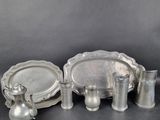 several pieces of silverware sitting on top of a table