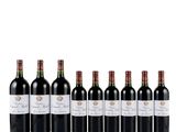 six bottles of red wine lined up in a row